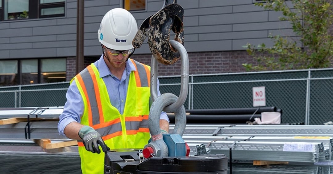 turner construction worker in PPE using clearstory for change orders